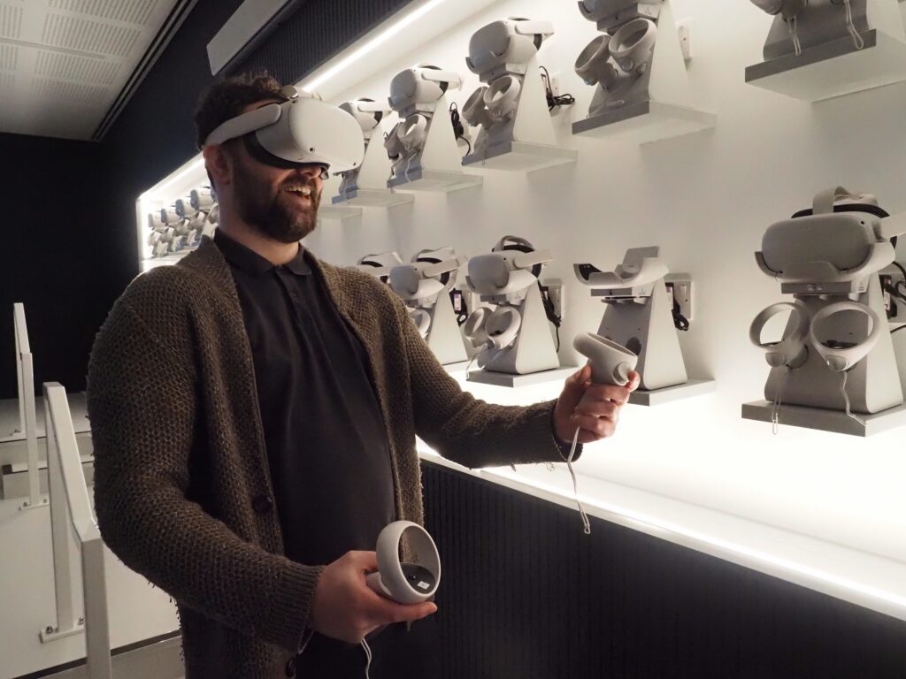 A man using a VR headset in the XR Lab - one of the group's venue hire spaces.