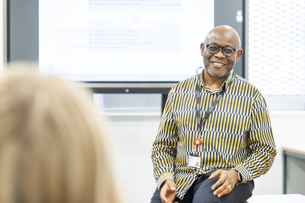 A man teaching in a classroom.