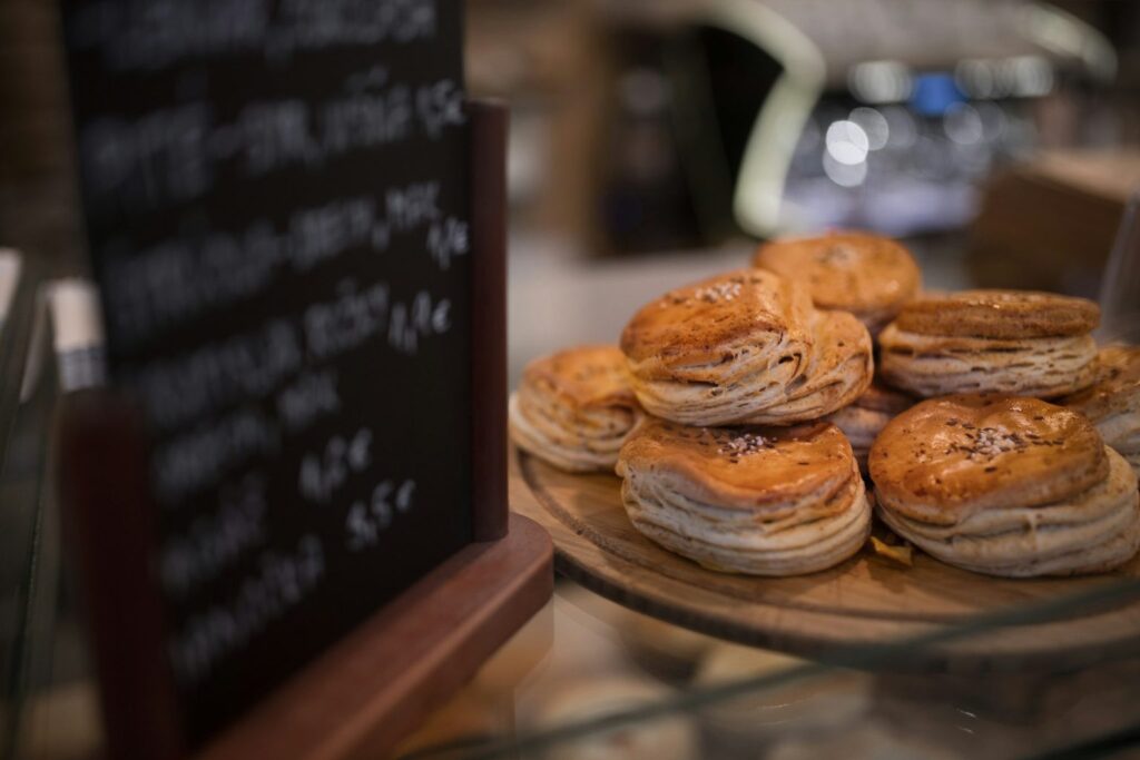 A batch of scones on a wooden stand