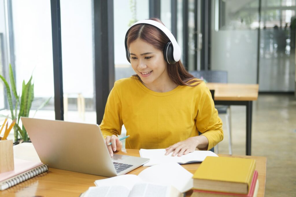 A student studying with headphone on