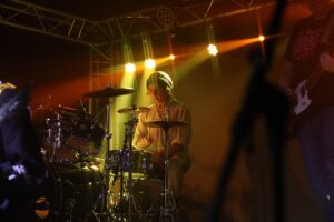 A student drummer from the Music Performance, Production and Live Events courses.